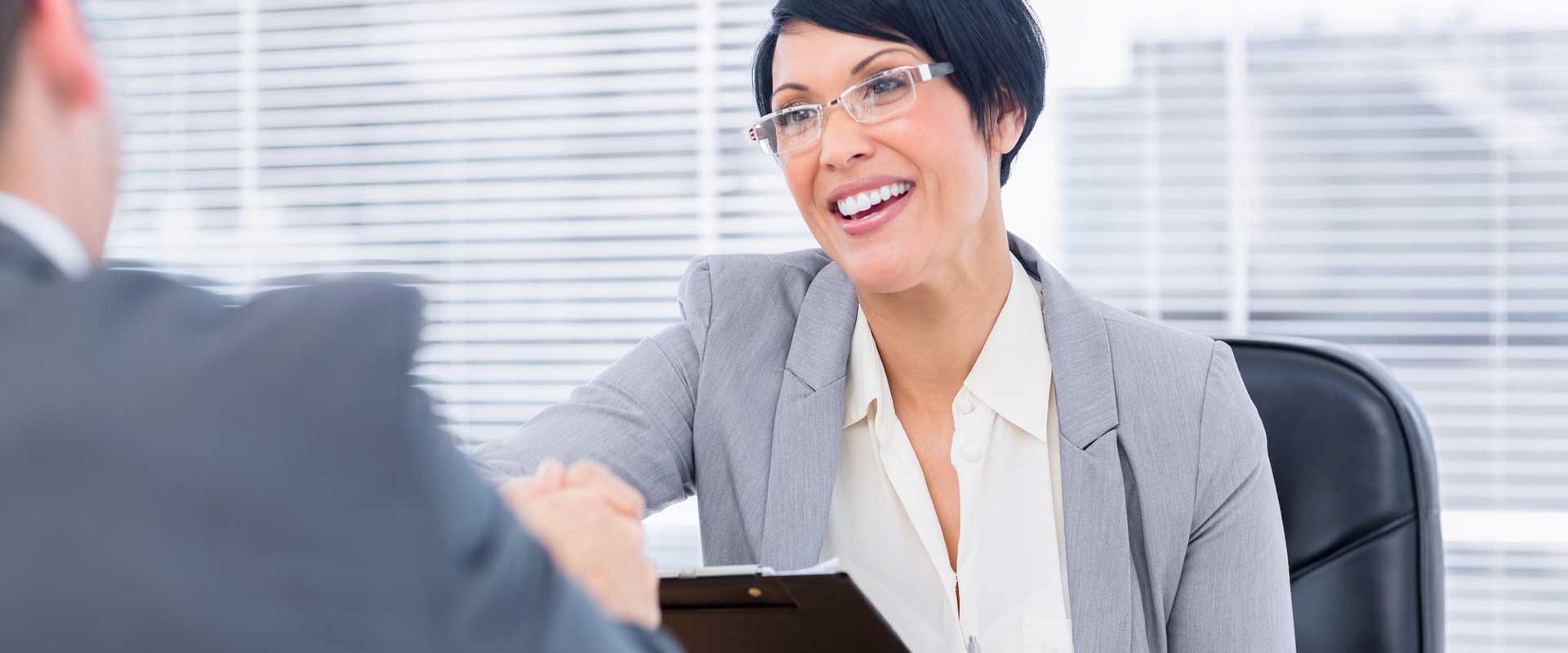 woman-big-smile-shaking-hands